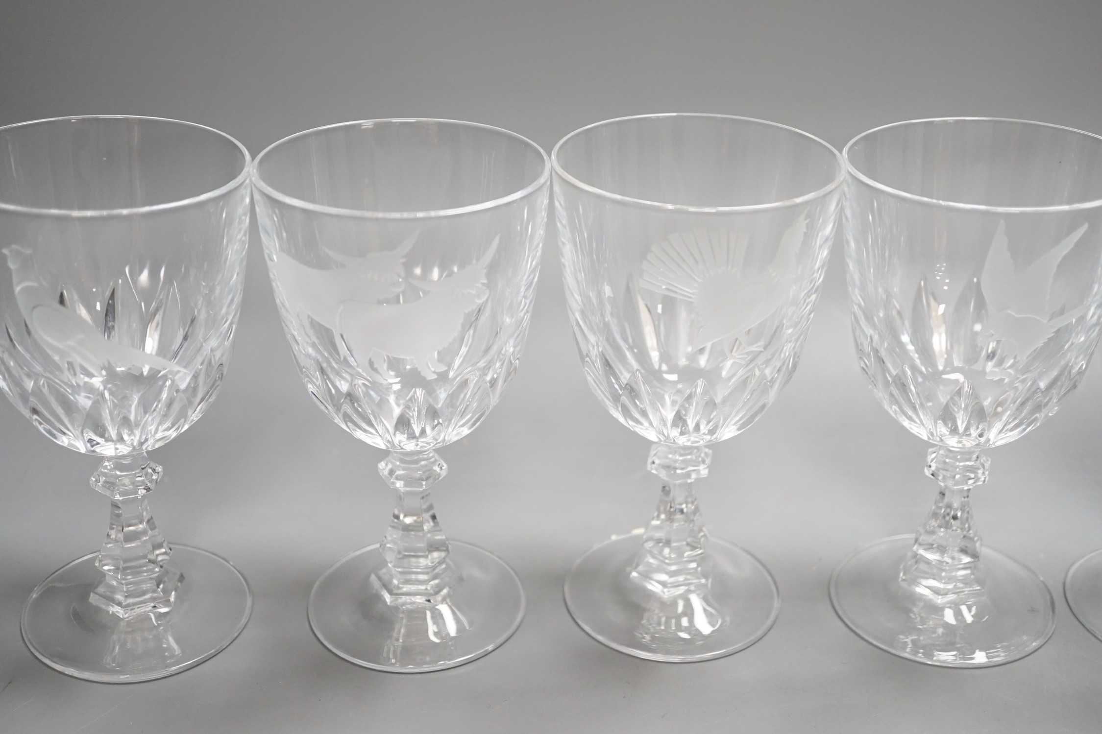 A set of six Scottish wine glasses, engraved with highland cattle and birds, 15cms high